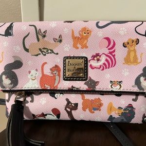 Dooney and Bourke fold over crossbody featuring Disney cats.